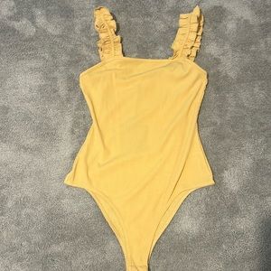 Yellow body suit